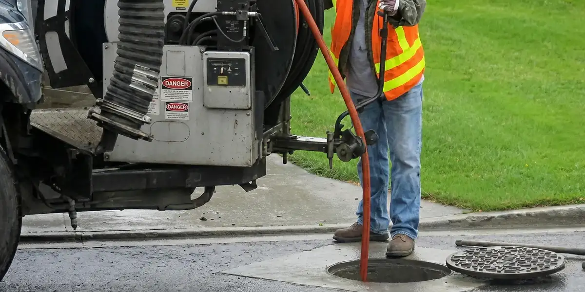 sewage clean up professionals using industrial equipment to remove contaminated wastewater in Oklahoma City, OK