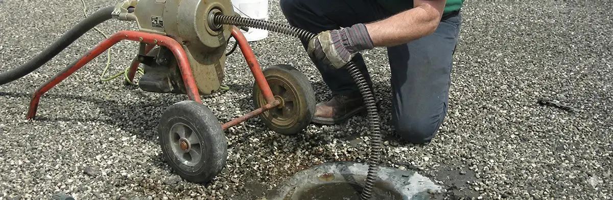 sewer rodding technician actively removing blockages from a sewer line in Oklahoma City, OK